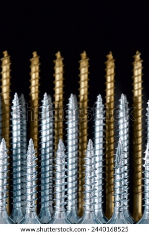 Close up of a large group of countersunk lag bolts for joining wood parts Royalty-Free Stock Photo #2440168525