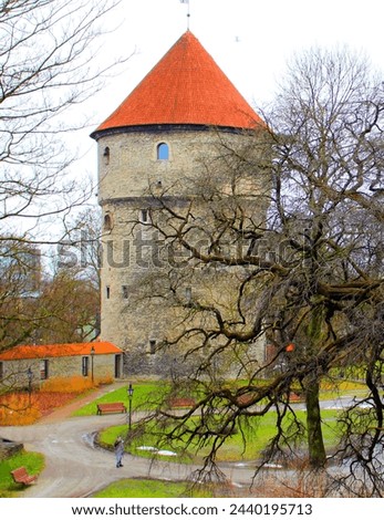A medieval castle in the historical center of Tallinn. The Estonian architecture of antiquity. The fort is a defensive structure in the old town. Royalty-Free Stock Photo #2440195713