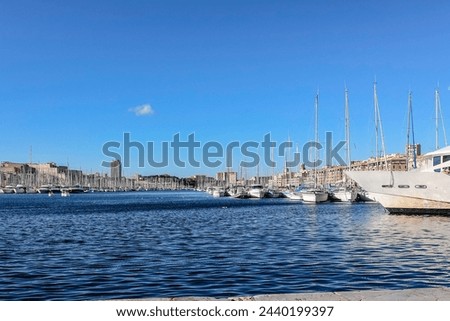 Panoramic view of old port of Marseille with yachts reflected in water, Marseille, France