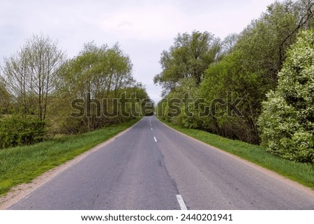paved road in cloudy weather in spring, windy cloudy weather and highway in rural areas