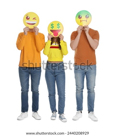 People covering faces with emoticons on white background