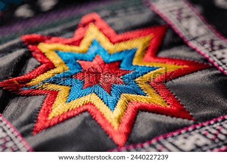 Texture of national Ukrainian patterns embroidered with an embroidery machine