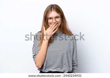 Teenager Russian girl isolated on white background happy and smiling covering mouth with hand