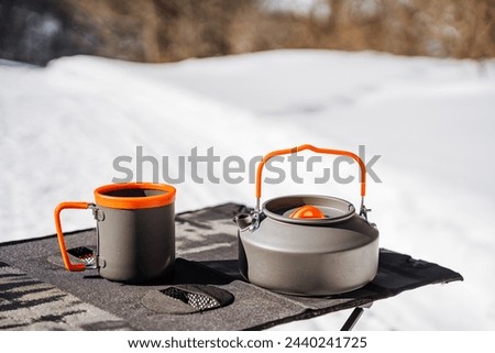 aluminum cookware, kettle with metal mug, camping utensils, tourist kitchen. High quality photo