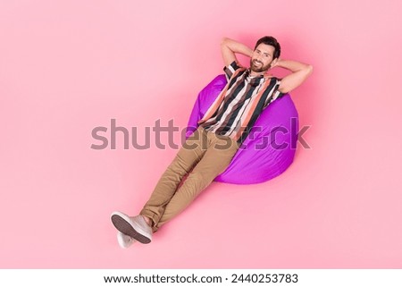 Top above high view photo of mature man take nap in office lounge resting lying purple bean bag isolated over pink color background