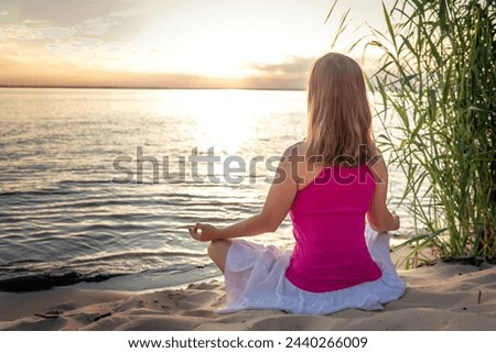 serenity and yoga practicing at the sea. sunset