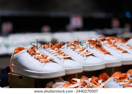 Canvas shoes were lined up on the store shelves. Men elegant shoes in a man clothing boutique. Shoes trade show. Royalty-Free Stock Photo #2440270507