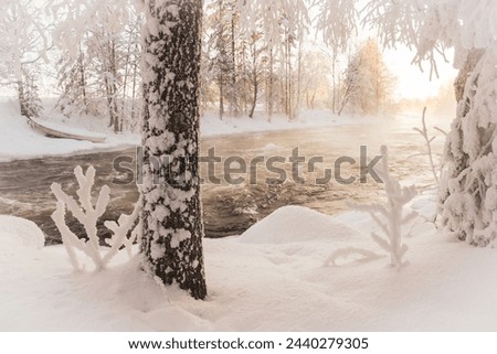 Sunrise on the river in winter. Puolakankoski, Kouvola, Finland Royalty-Free Stock Photo #2440279305