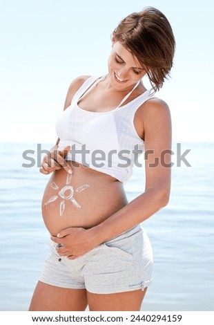 Summer, beach and pregnant woman outdoor with sunscreen on stomach with happiness. Healthy, pregnancy and care for body with skincare, cream and lotion to protect skin at sea on holiday or vacation