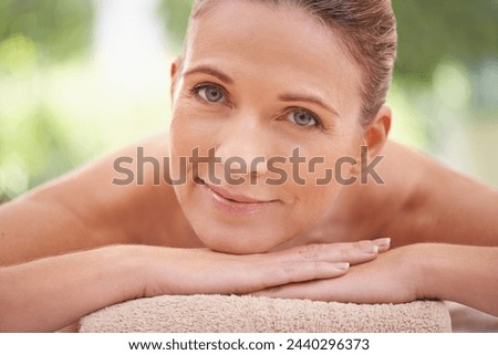 Closeup, portrait or woman in skincare, beauty or glow of flawless skin, spa or peace in wellness. Girl, smile or lying on massage, table or towel in mental health, cosmetology or self care at clinic