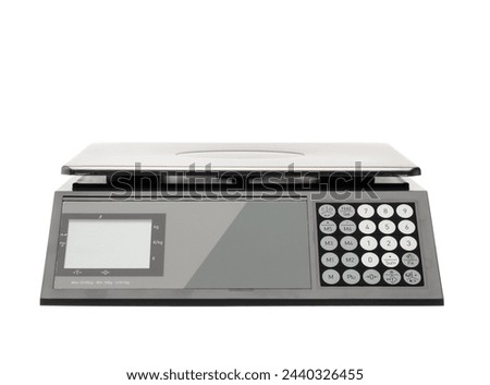 Industrial scale for weighing items and food for sale. Gray metal scales isolated on a white background. Royalty-Free Stock Photo #2440326455