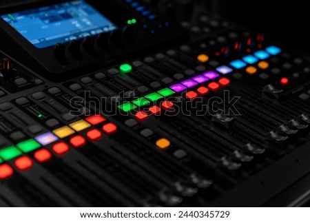 Mixer control. Music engineer. Backstage controls on an audio mixer, Sound mixer. Professional audio mixing console with lights, buttons, faders and sliders. sound check for concert. Royalty-Free Stock Photo #2440345729