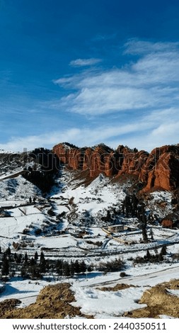 Portrait shot of snow mountain in Kyrgyzstan, Vertical picture of a snow mountain, Picture of a village in snow