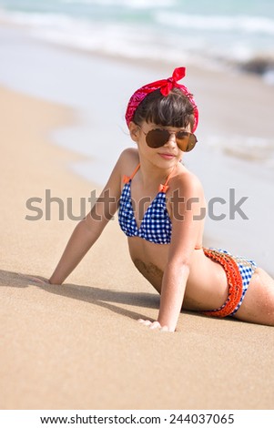 Girl in sunglasses on the beach  
