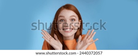 Happy rejoicing emotional young smiling redhead girl blue eyes getting exciting news grinning cheering happily raise hands thrilled wide eyes surprised accepted famous university, blue background.