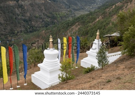 Temple in Punakha Valley with Stupa and colorful prayer flags in Bhutan Asia