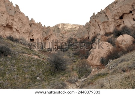 Zelve open air museum, one of the natural beauties of the Cappadocia region. The old residential area of Zelve Valley. Cave houses. Fairy chimneys and volcanic formations. Royalty-Free Stock Photo #2440379303