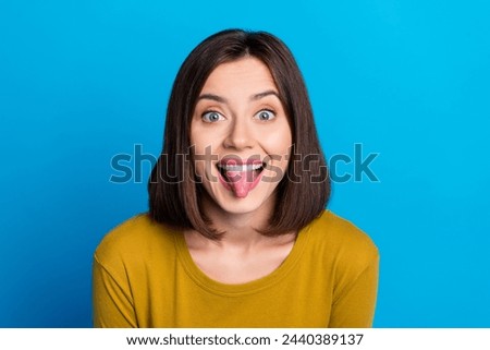 Photo of funky tricky lady dressed shirt stick out smiling empty space isolated blue color background