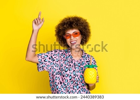 Photo of sweet funky woman wear animal print shirt dark glasses drinking fruit cocktail isolated yellow color background