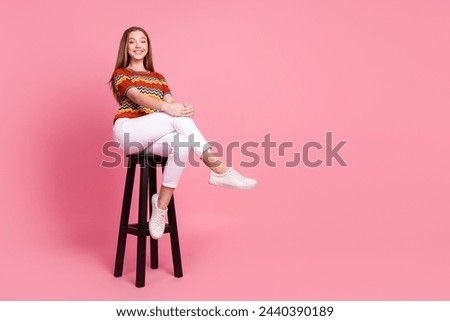 Full body portrait of satisfied glad cute person sit chair empty space ad isolated on pink color background Royalty-Free Stock Photo #2440390189