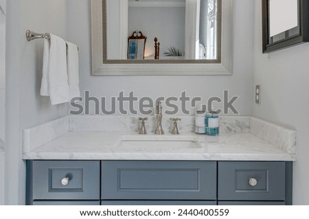 Spring Spa-Like Bathroom with Luxury Vanity, Marble Countertop, Framed Mirror, Decorative Accents