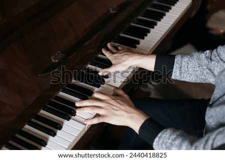 Mail piano hands play on piano keys. Male fingers play the piano background. Studding to play the piano
