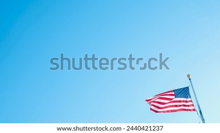American flag in the blue sky 