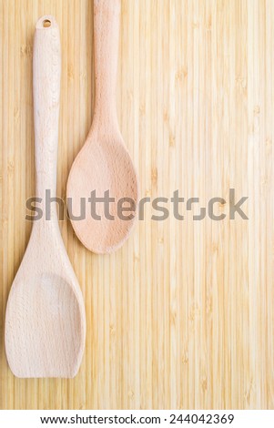 Kitchen utensils on wooden board