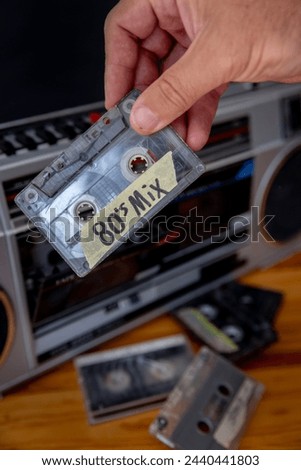 Cassette tape with stereo in the background