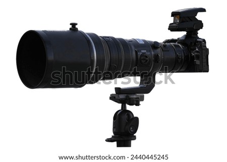 A camera with a lens mounted on a tripod. Isolated photos on a white background This one has a clip path.