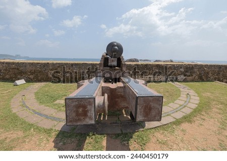 Old colonial artillery cannons on bastion along the coast line of Galle, Southern Province of Sri Lanka Royalty-Free Stock Photo #2440450179