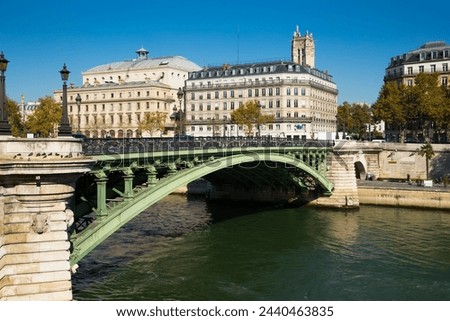 View of Pont Notre-Dame across Seine linking right bank of Paris with Ile de la Cite, France Royalty-Free Stock Photo #2440463835