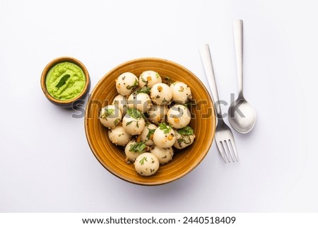 Soft and spongy Idli balls or goli idly with green and red chutney, south indian food recipe Royalty-Free Stock Photo #2440518409