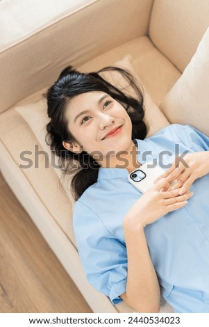 Photo of young Asian girl at home