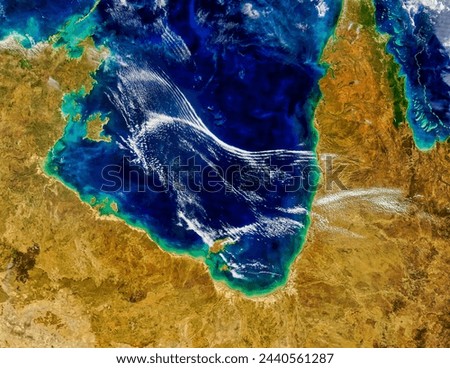 Atmospheric gravity waves in the Gulf of Carpentaria, Australia. Atmospheric gravity waves in the Gulf of Carpentaria, Australia. Elements of this image furnished by NASA. Royalty-Free Stock Photo #2440561287