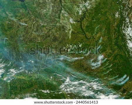 Fires and smoke in central Russia. Fires and smoke in central Russia. Elements of this image furnished by NASA. Royalty-Free Stock Photo #2440561413