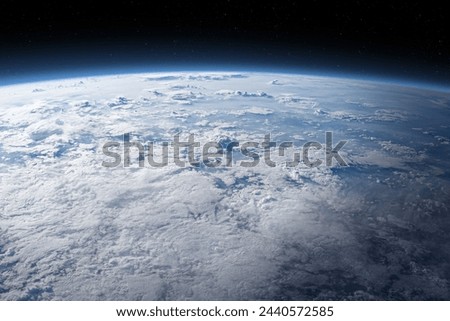 The Earth surface is covered by clouds. Photo of Earth covered in clouds. Clouds covering a immense area of the planet and shaping the Earth's climate. Elements of this image furnished by NASA.
 Royalty-Free Stock Photo #2440572585