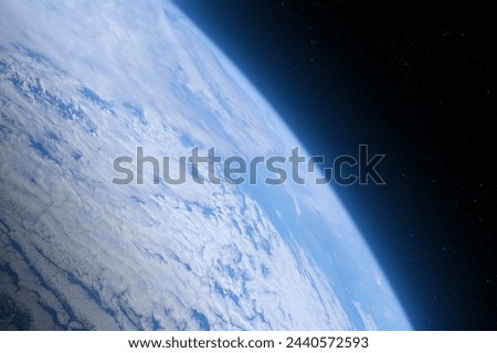 Blue Earth in the space. View of the Earth from near space. Elements of this image furnished by NASA. Royalty-Free Stock Photo #2440572593