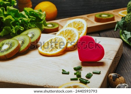 Healthy vegetarian meal concept with heart-shaped figure as a symbol of heart disease. Raw food and a special diet for wellbeing