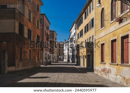 View of street with pretty colorful houses in Dorsoduro Venice, Italy Royalty-Free Stock Photo #2440595977
