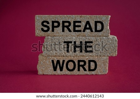 Spread the word symbol. Brick blocks with text Spread the word. Beautiful red background, copy space. Business, motivational concept.