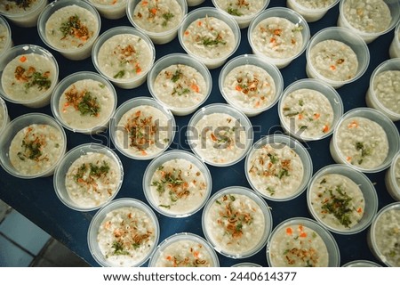 Picture of chicken rice porridge from a top angle view using natural light. This chicken rice porridge is usually prepared for followers of the Islamic religion in the month of Ramadan.