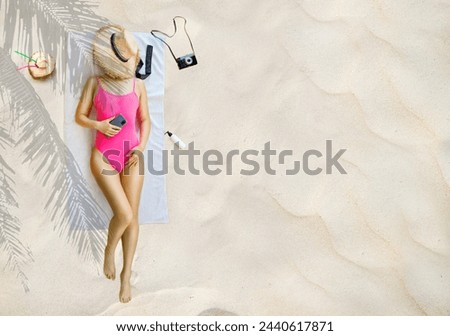 Top view from above young woman of Asian ethnicity in pink swimsuit lies on towel hotel pool isolated on sand beach background. Summer vacation sea rest suntan concept