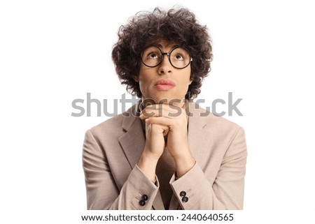 Young man with glasses looking up isolated on white background