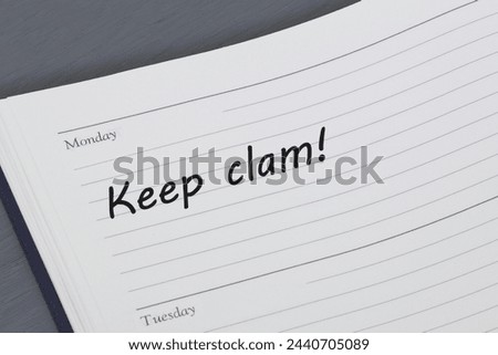 Keep calm reminder message in an open diary
