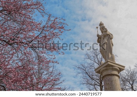 A picture of the beginning of spring in Germany in 2024 with a statue of Mary and Jesus
