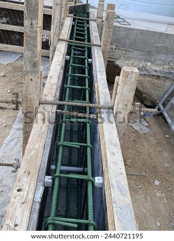 Ground beam shuttering work and ground beam reinforcement work of building, building sub structure work Royalty-Free Stock Photo #2440721195