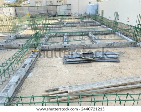 Ground beam shuttering work and ground beam reinforcement work of building, building sub structure work Royalty-Free Stock Photo #2440721215