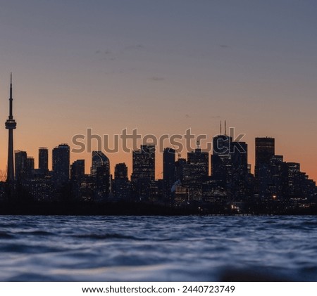 Toronto skyline at dusk from across Lake Ontario