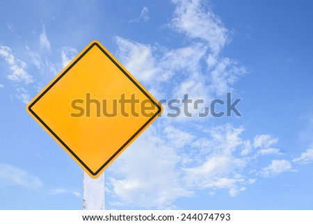 Yellow traffic sign isolated on blue sky background